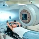Woman lying on a medical machine
